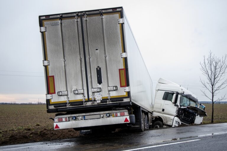 damaged white truck involved in an accident due to negligence.