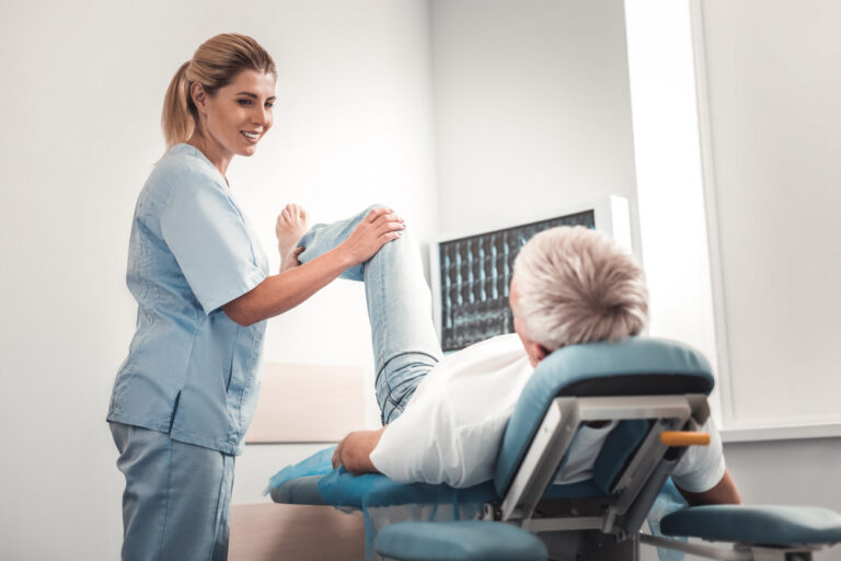 car accident victim receiving chiropractor assistance