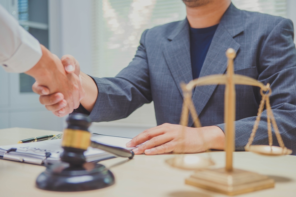 lawyer and client after discussing settlement amounts in mediation